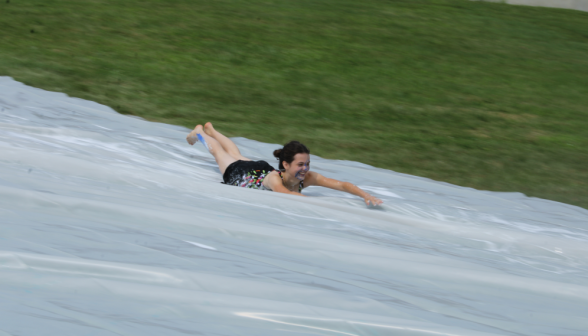 Close-up: a student at high speed on the slide