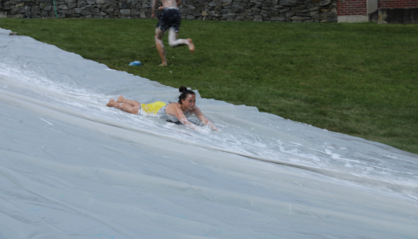 A student in motion down the slide