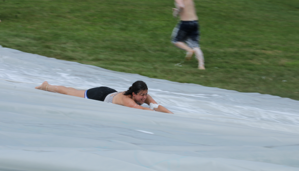 Another student on the slide, doing the "Superman" on the way down