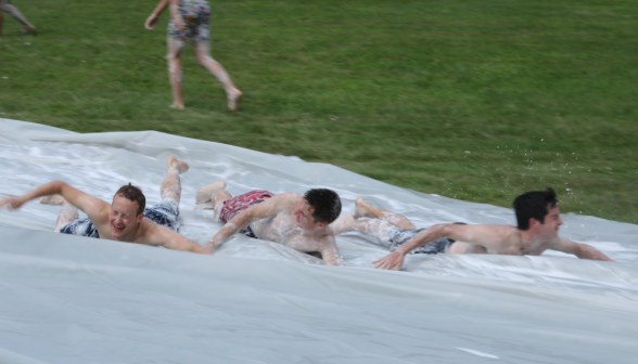 Three going down the slide together