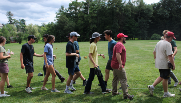 Students pass one another high-fiving