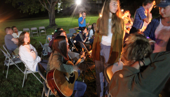 A student produces a guitar for some impromptu folk singing!