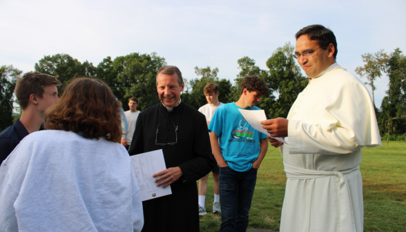 Frs. Miguel and Markey chatting with the students