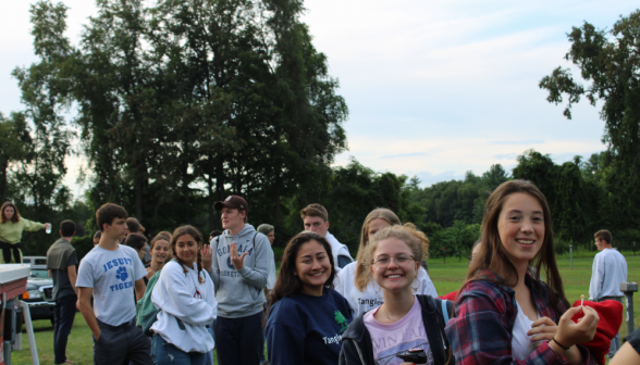 Another group of students smiles at the camera