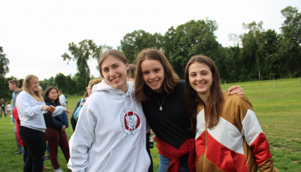 Three students pose for a picture