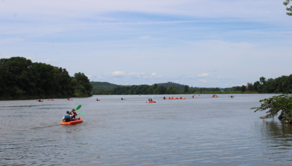 The entire fleet of kayaks, strung out across the river