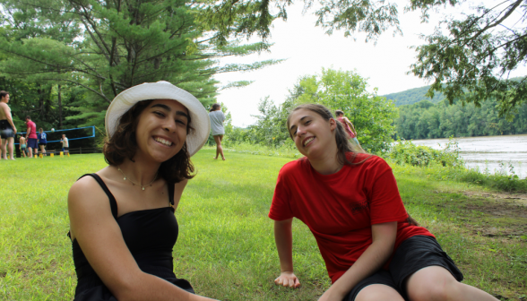 Two students relaxing on the grass