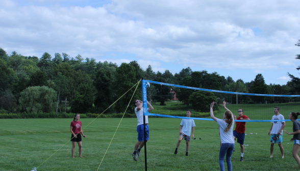 Students play volleyball