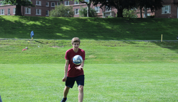 Students play volleyball