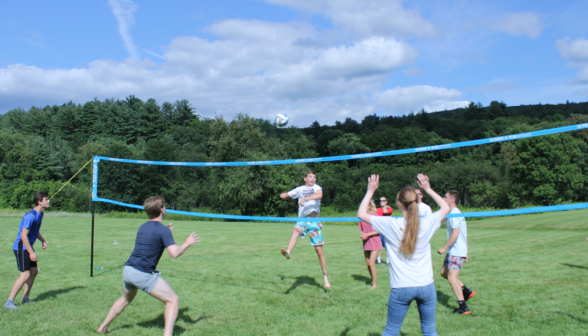 Students play volleyball