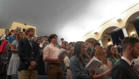 The students fill the auditorium seating