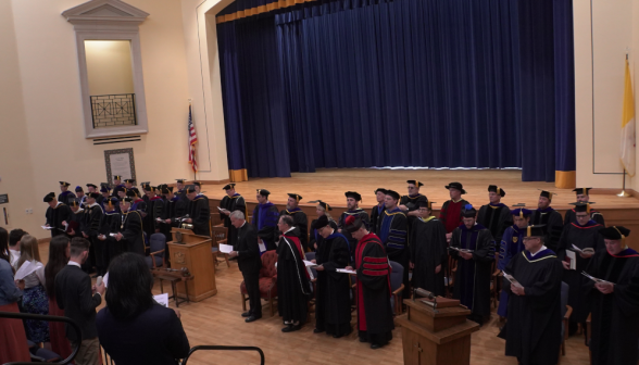 The tutors, standing, are all assembled