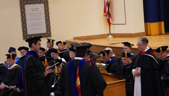 Fr. Paul leads the new tutors in their Oath of Fidelity