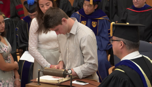 Another incoming students signing the register