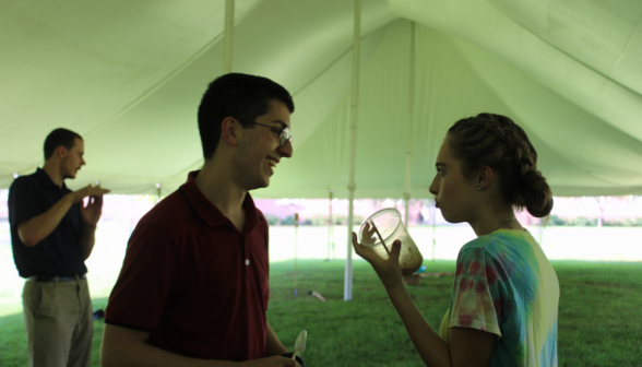 Two freshman chat over their floats