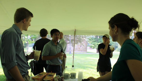 Students make conversation around the float preparation table