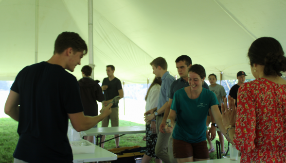 Prefects laughing around the table as they construct floats