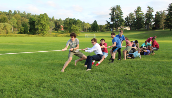 Right team pulls; various members fall over backwards