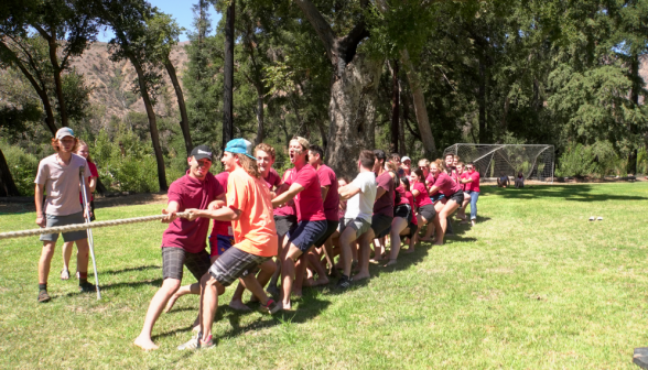 Team red plays tug-of-war, pulling for all its might