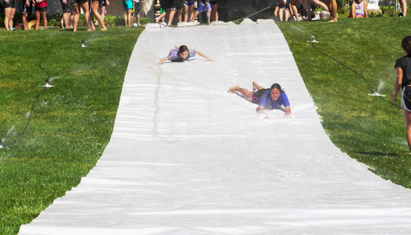 Another shot of students hurtling down the slide