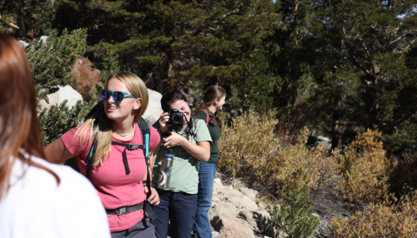 Balanced on a hillside, another photographer photographs the photographer!