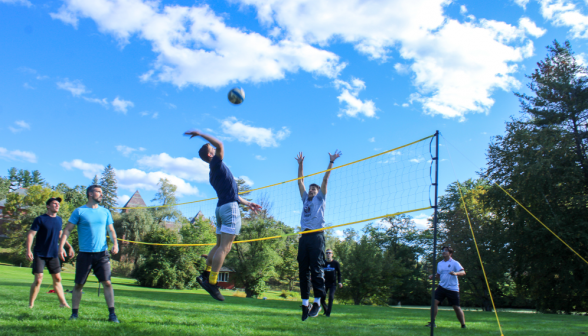 Students play volleyball