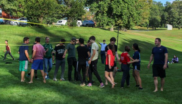 Students play volleyball