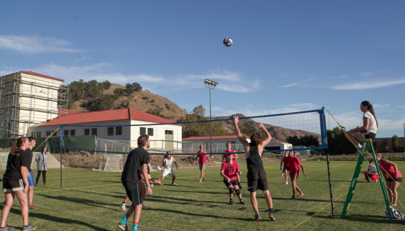 Students playing volleyball