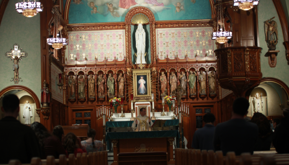 Fr. Markey at the center of the altar, celebrating Mass in the chapel