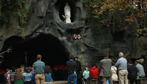 The students pray the Rosary at the Lourdes grotto