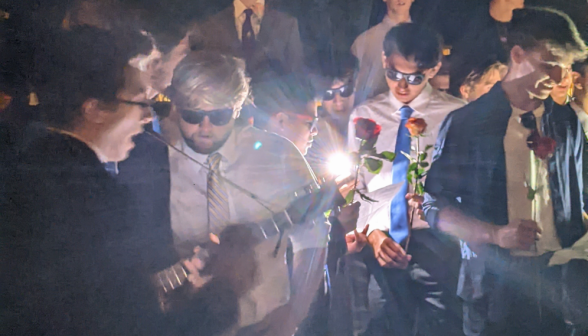 Roses and guitars in hand, the male students serenade the women