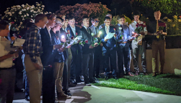 In suits and ties and with roses, the men sing to the women