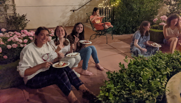 Students relax on the dorm patio