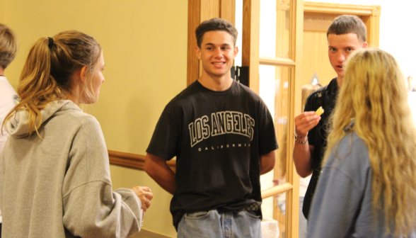 Students chat in the doorway