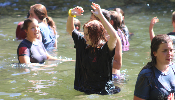 Students relax in the pond