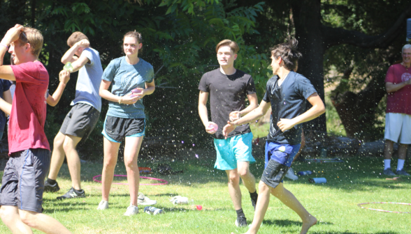 Behind the front lines, students re-arm in the water-balloon fight