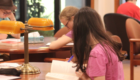 Student reads their book