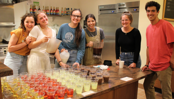 Prefects pose around a table of newly-made drinks in the coffee shop