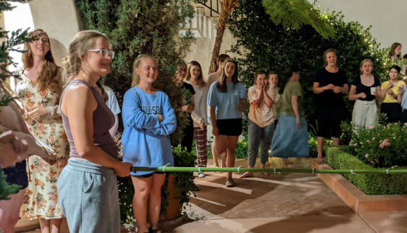 In the dorm courtyard, students prepare to play Limbo
