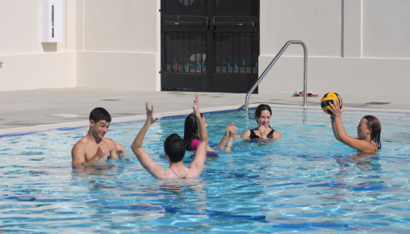 Five students play water polo