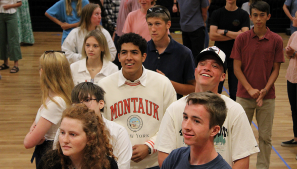 A group of students looking up at the instructor