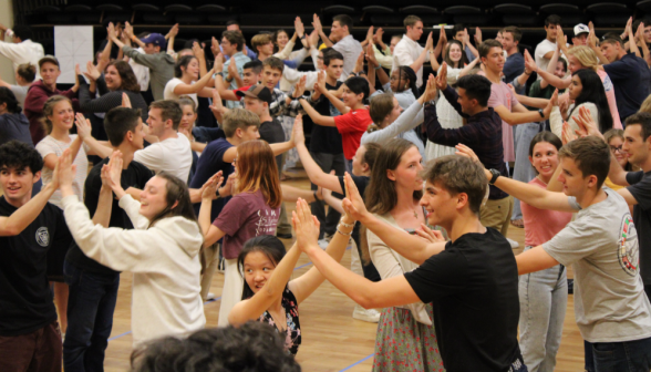 All across the dancefloor, students practice a dual simultaneous turn