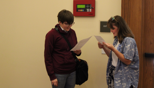 Two students read a script