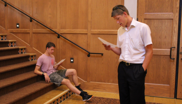 Two other students read a skit script