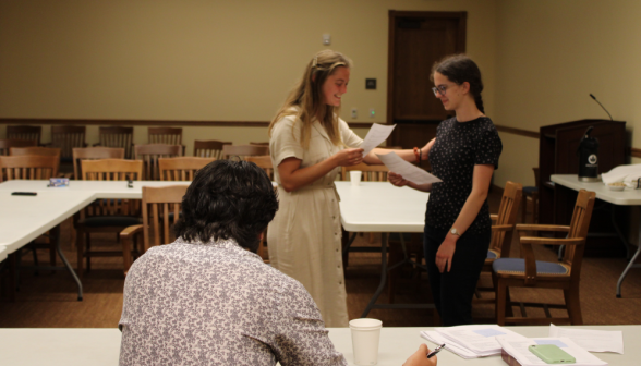 Two others practice their skit