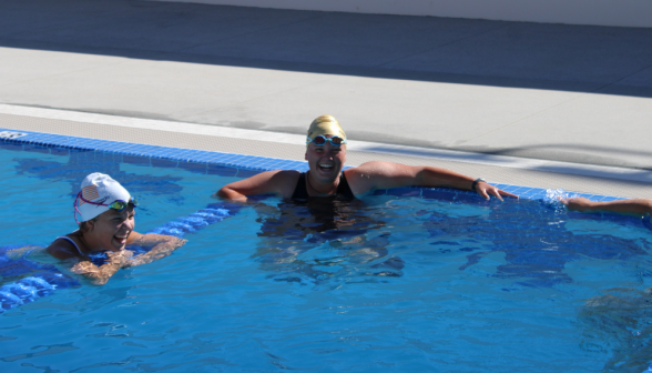 Two relax in the pool