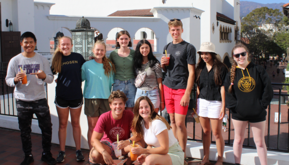 A group of student pose with smoothies