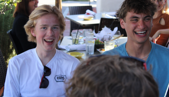 Two programmers at an outdoor table