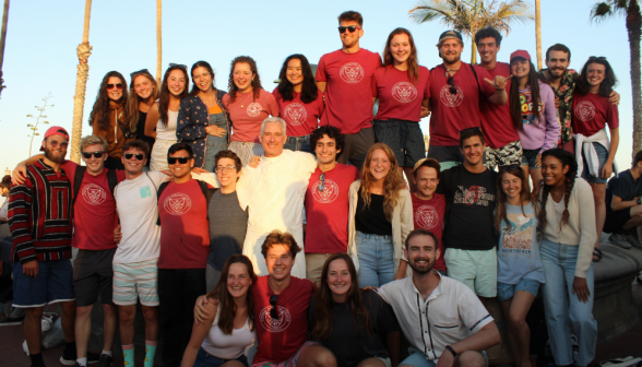 A group of many of the students along with Fr. Walshe pose on the side of the Fountain