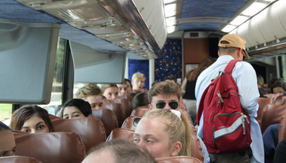 Inside the bus, students settle down for the ride